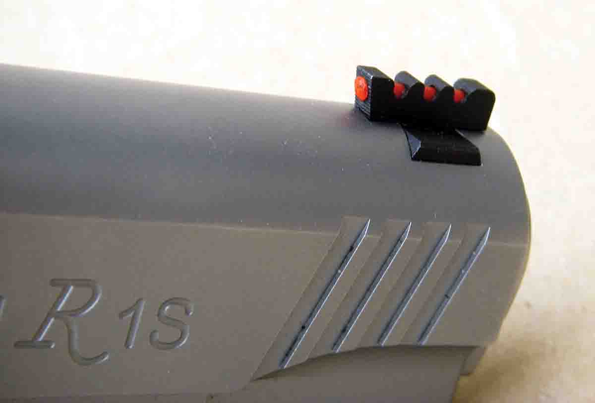 The Enhanced Commander front sight is dovetailed in place and features a red fiber optic insert.